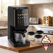 IceCream Smart machine with three dessert tubs on a sunny timber kitchen island
