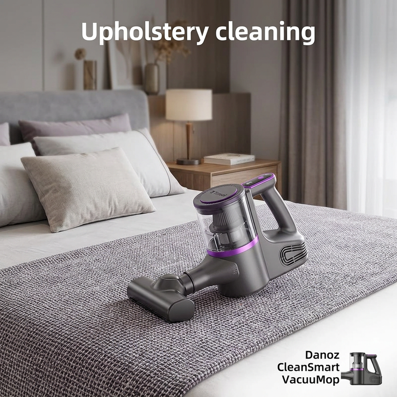 Danoz CleanSmart handheld vacuum with upholstery attachment on a bed