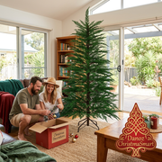 Unlit sparse Christmas tree with a couple preparing decorations