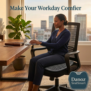 Woman using SeatSmart cushion while working at desk