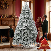Parents and children admiring snow-flocked fir Christmas tree