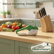 KniveSmart compact manual sharpener in profile beside vegetables and a knife block