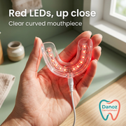 Close-up of clear U-shaped DentalSmart mouthpiece and red LEDs