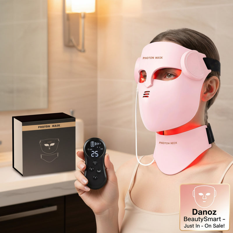 Person wearing a pink photon mask with a control device on a white background