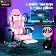 An Artiss Massage Gaming Chair in pink and white color, featuring a retractable footrest and being showcased in a home office setup.