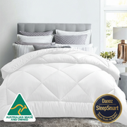 A single-sized, white microfibre quilt on a bed in a stylishly decorated bedroom, with the Australian Made logo visible.
